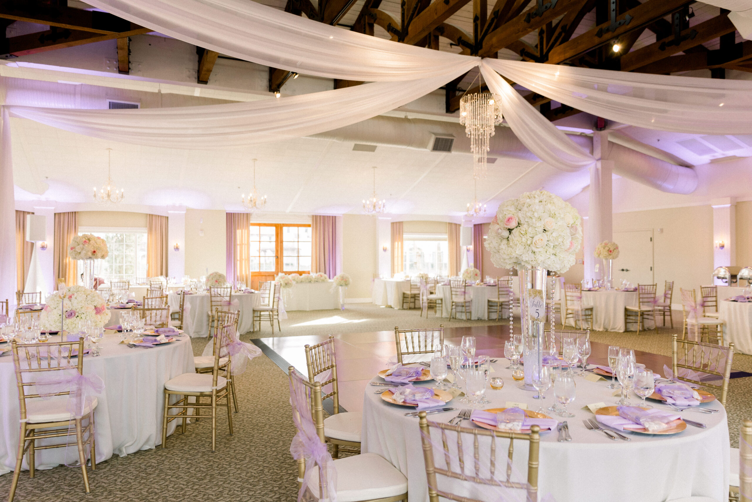 The Pavilion room with wedding table and chair setup