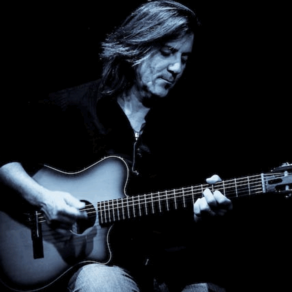 Musician singing and playing guitar