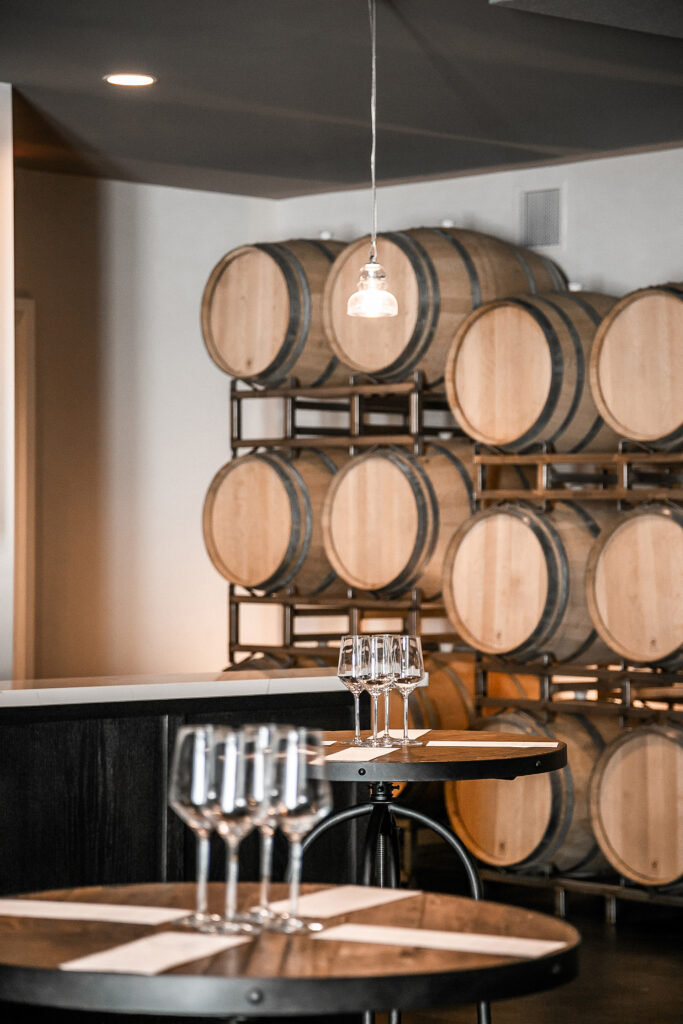 The barrel room with glasses and menus on the table