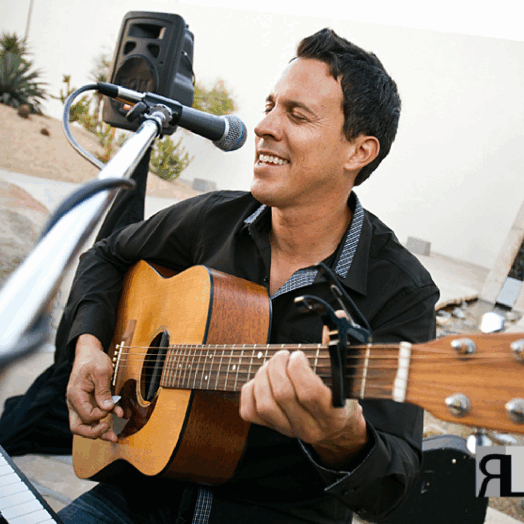 Brian Stodart singing and playing guitar
