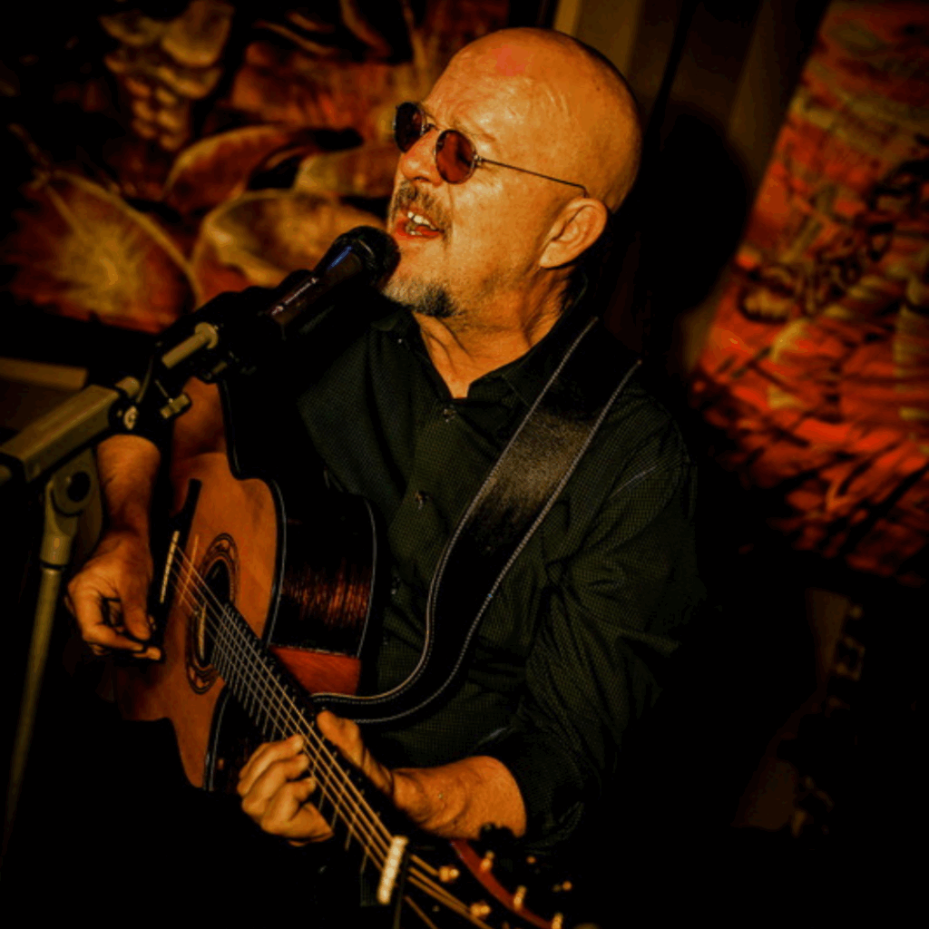 Dave Weaver singing and playing guitar