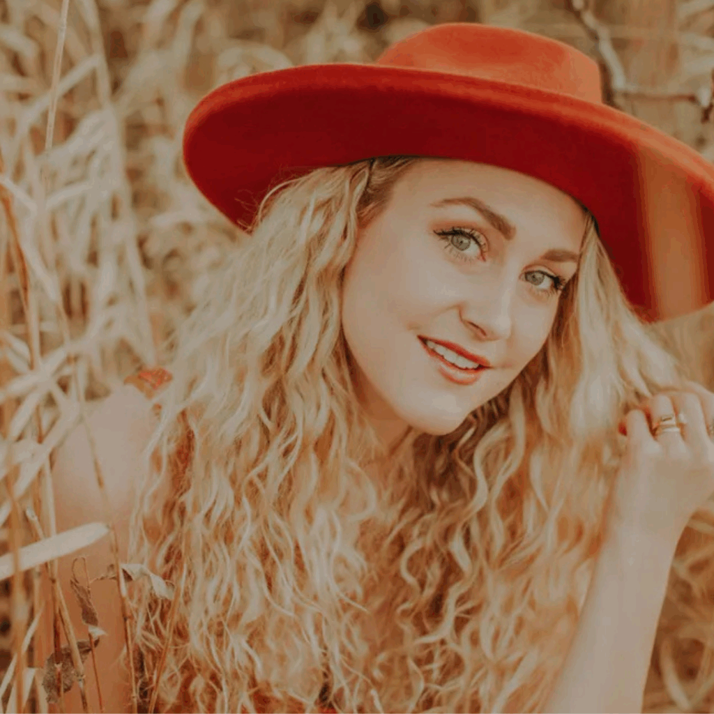 Sophie D singing and playing guitar