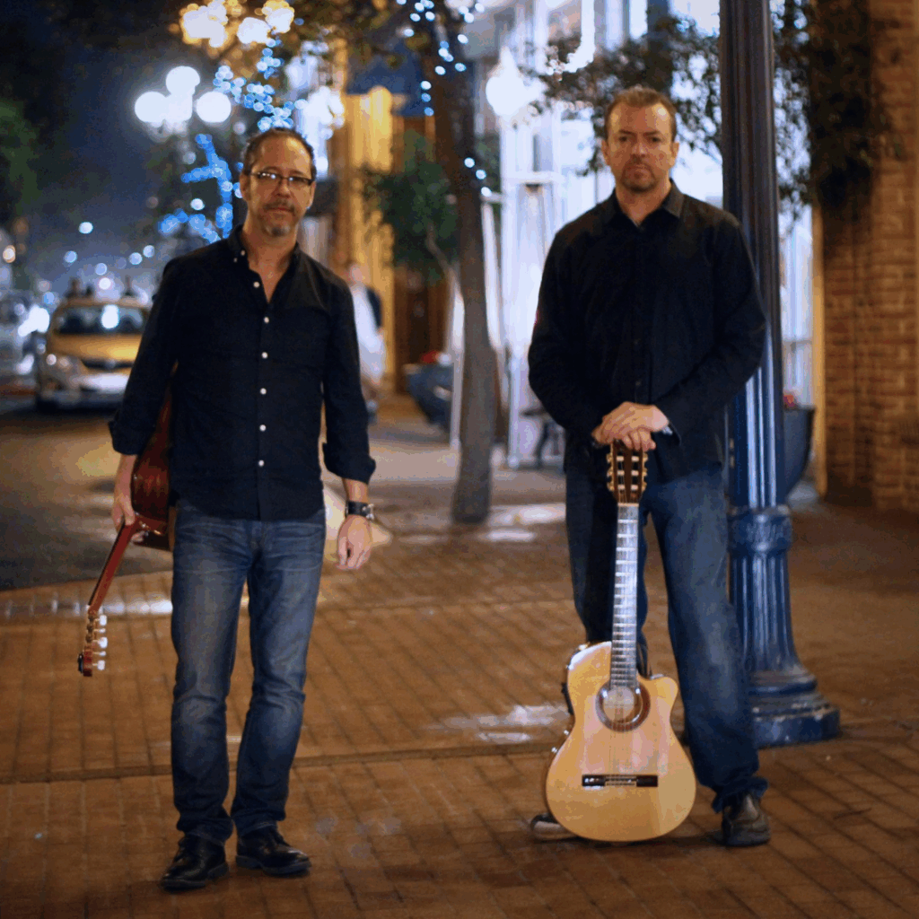 Sophisticados posing with their guitars for a photo