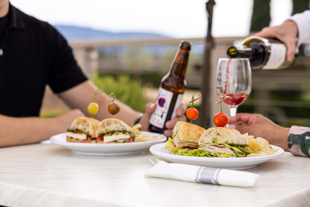 THE DECK at Ponte Winery, pouring red wine with two sandwiches