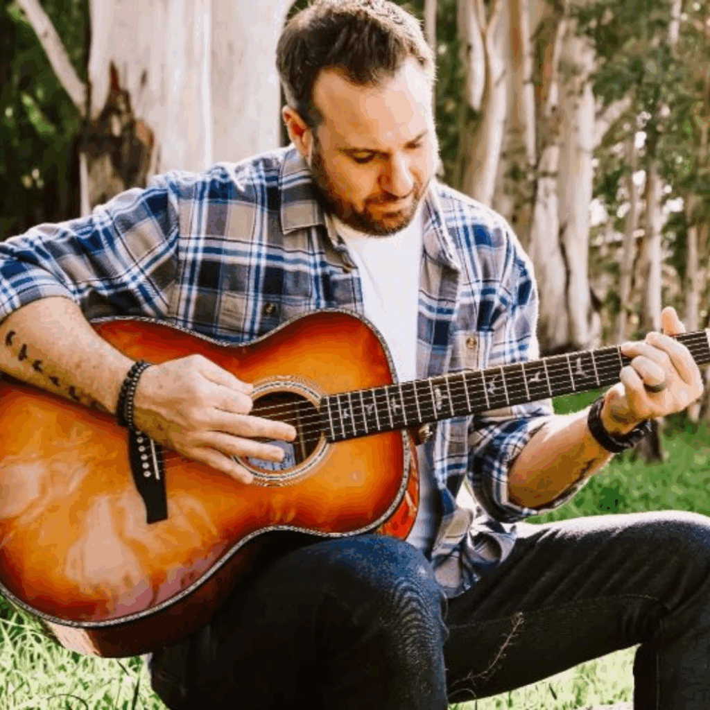 Zach Hornsey singing and playing guitar